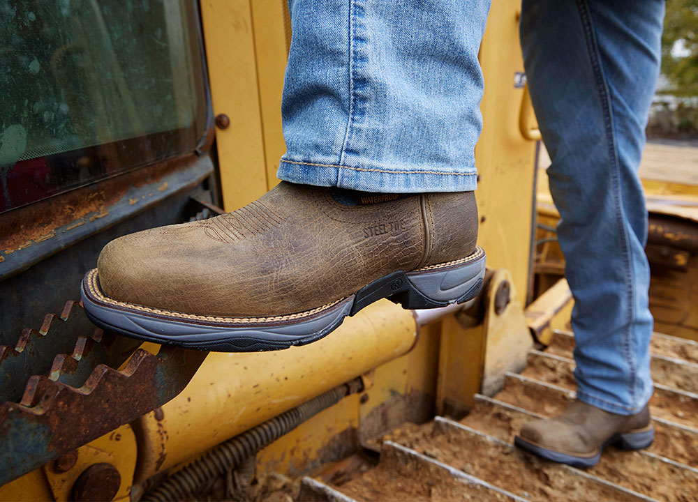 A Man Wearing the Bartlett 11" Pull-On Steel Toe Work Boots in Grey
